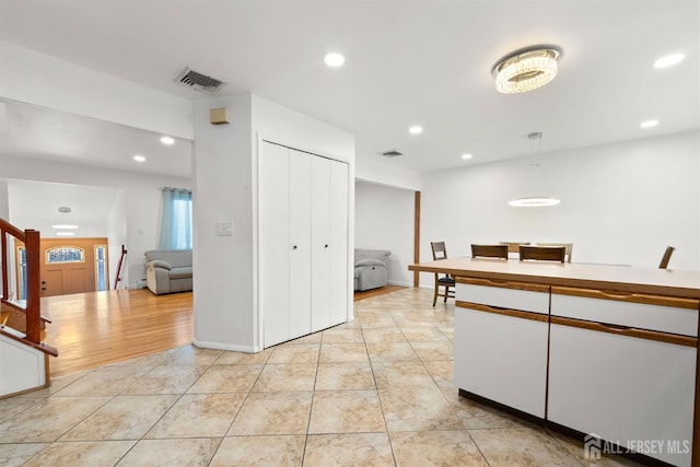 2291 Morrison Ave, Union Twp, NJ 07083 - kitchen with light tile patterned floors, recessed lighting, white cabinetry, and open floor plan