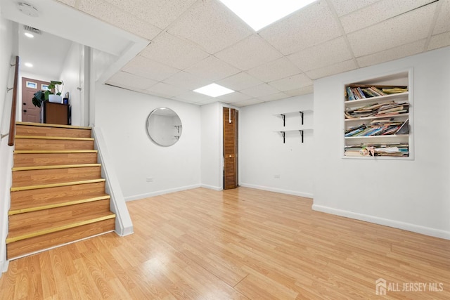 2291 Morrison Ave, Union Twp, NJ 07083 - finished below grade area with stairway, wood finished floors, a drop ceiling, and baseboards
