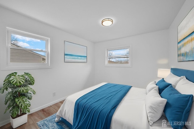 bedroom with hardwood / wood-style flooring