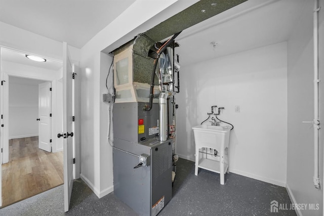 utility room with heating unit