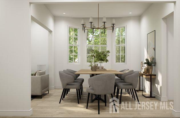 25 Wicker Pl, Morganville, NJ 07751 - dining area with a chandelier, wood finished floors, baseboards, and recessed lighting