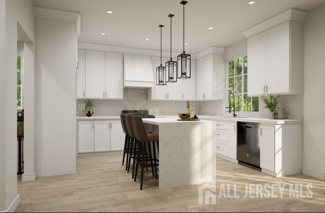 25 Wicker Pl, Morganville, NJ 07751 - kitchen featuring dishwashing machine, premium range hood, a sink, light countertops, and decorative backsplash
