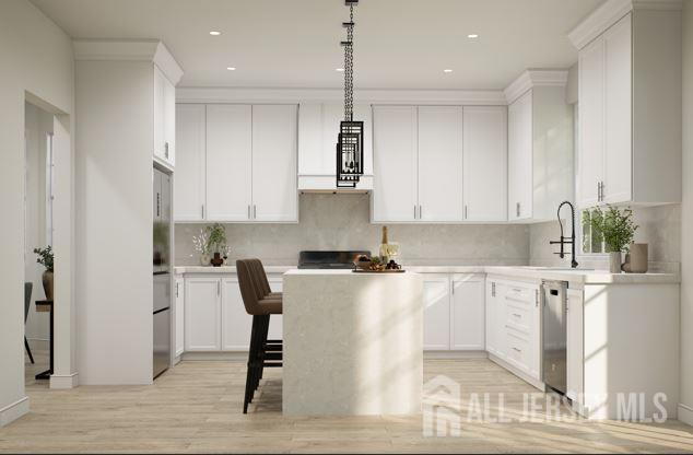 25 Wicker Pl, Morganville, NJ 07751 - kitchen featuring appliances with stainless steel finishes, light countertops, a sink, and recessed lighting