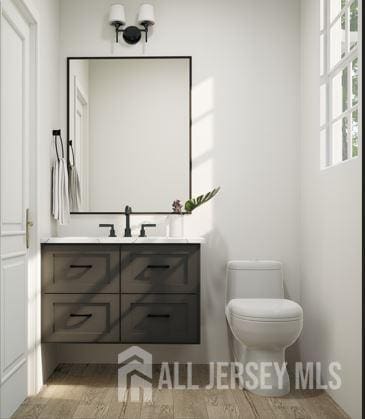 25 Wicker Pl, Morganville, NJ 07751 - bathroom featuring vanity, toilet, and wood finished floors