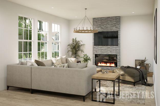 25 Wicker Pl, Morganville, NJ 07751 - living area with a fireplace, wood finished floors, and recessed lighting