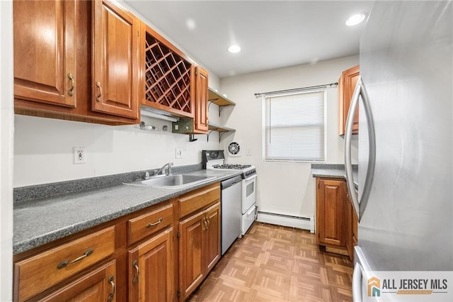 kitchen with brown cabinetry, stainless steel appliances, a baseboard heating unit, open shelves, and a sink