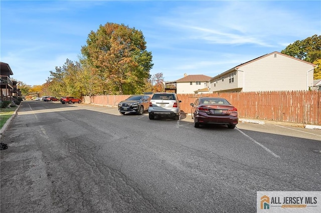 view of road with sidewalks and curbs