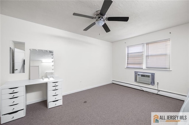 unfurnished office with a baseboard radiator, dark carpet, an AC wall unit, a textured ceiling, and baseboards