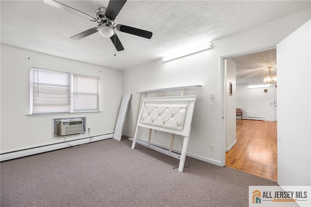 unfurnished bedroom featuring a baseboard heating unit, a wall mounted AC, a textured ceiling, and light colored carpet