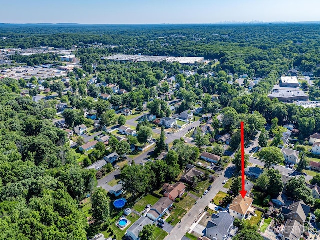 birds eye view of property with a residential view