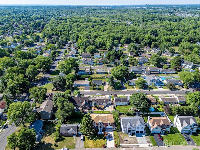 bird's eye view with a residential view and a wooded view