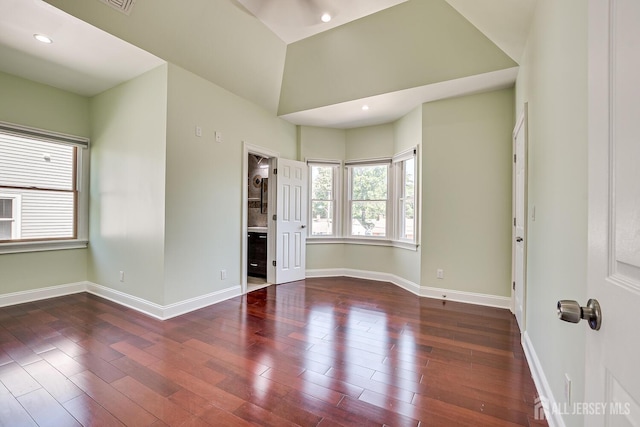 spare room with recessed lighting, wood finished floors, and baseboards