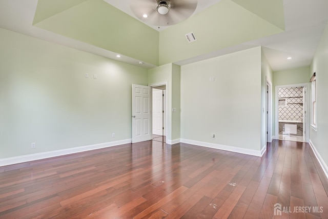 unfurnished bedroom with recessed lighting, dark wood-style flooring, visible vents, and baseboards