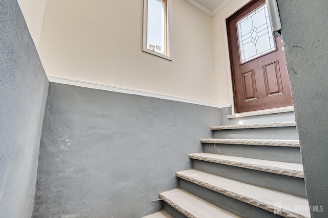 stairs with crown molding