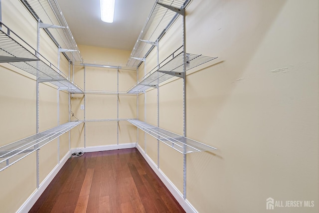 spacious closet with wood finished floors