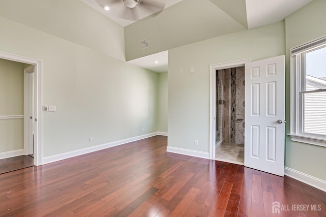 unfurnished bedroom featuring baseboards, visible vents, wood finished floors, and recessed lighting