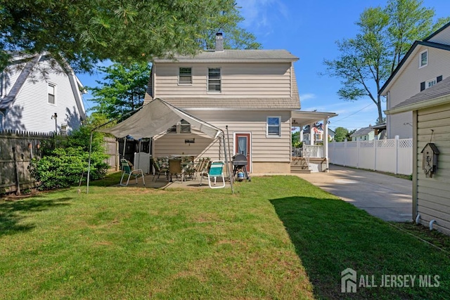 340 Runyon Ave, Middlesex, NJ 08846 - rear view of house with a patio, a chimney, and driveway