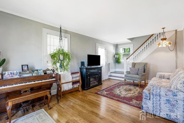 340 Runyon Ave, Middlesex, NJ 08846 - living room featuring stairway, wood finished floors, crown molding, and a glass covered fireplace