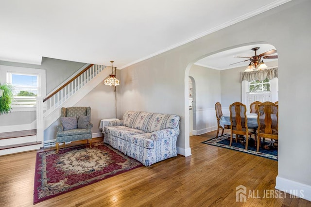 340 Runyon Ave, Middlesex, NJ 08846 - living room with plenty of natural light, ceiling fan, arched walkways, wood finished floors, and ornamental molding