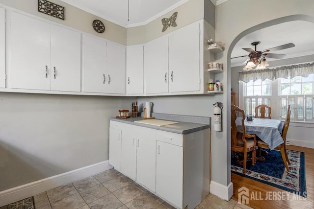 340 Runyon Ave, Middlesex, NJ 08846 - kitchen with baseboards, ceiling fan, ornamental molding, and white cabinetry