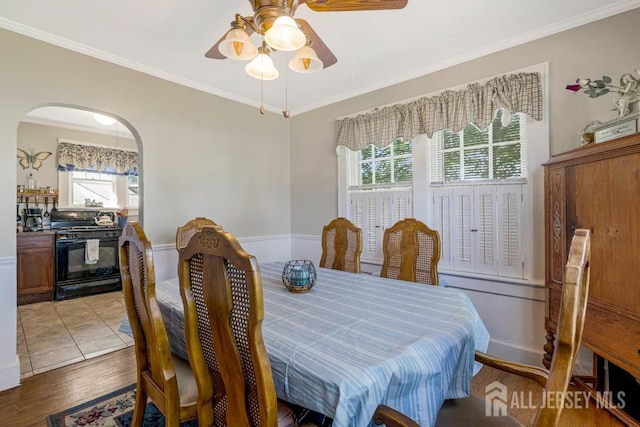 340 Runyon Ave, Middlesex, NJ 08846 - dining room with healthy amount of natural light, ceiling fan, crown molding, arched walkways, and light wood finished floors