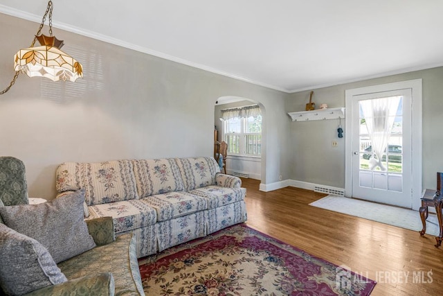 340 Runyon Ave, Middlesex, NJ 08846 - living area featuring arched walkways, wood finished floors, ornamental molding, and baseboards
