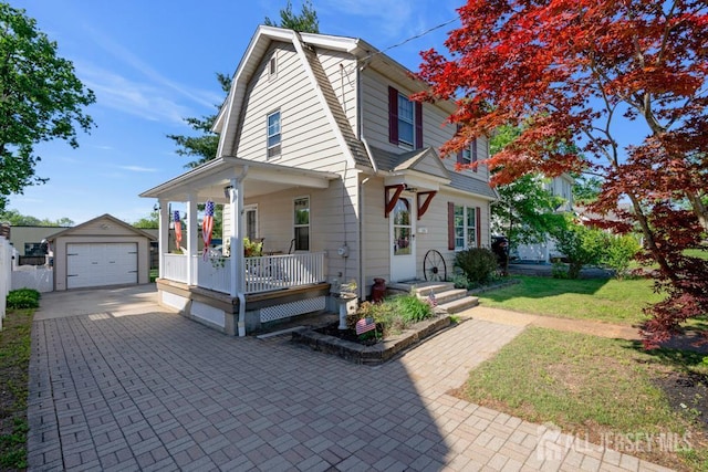 340 Runyon Ave, Middlesex, NJ 08846 - view of front facade featuring a gambrel roof, an outbuilding, covered porch, driveway, and a detached garage