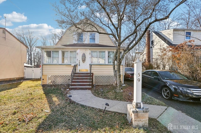 dutch colonial with entry steps and a gambrel roof