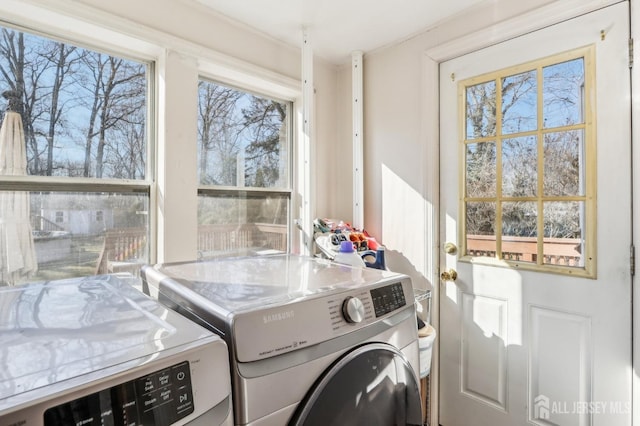 clothes washing area with laundry area and separate washer and dryer