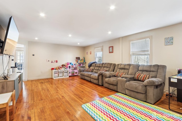 living room featuring recessed lighting and light wood-style flooring