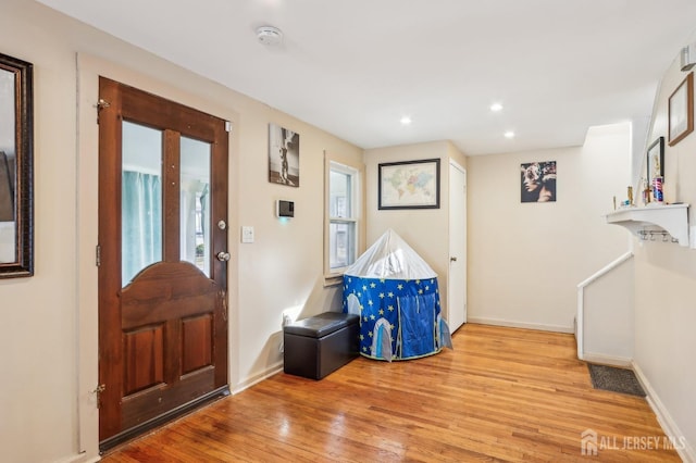 entrance foyer featuring recessed lighting, wood finished floors, visible vents, and baseboards