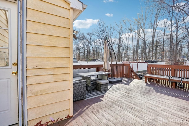 wooden terrace featuring an outdoor hangout area