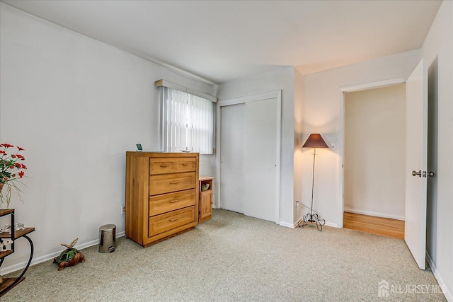 115 Broadway Ave, Colonia, NJ 07067 - bedroom with light carpet, a closet, and baseboards