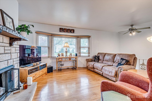 115 Broadway Ave, Colonia, NJ 07067 - living room featuring wood finished floors, ceiling fan, and a fireplace