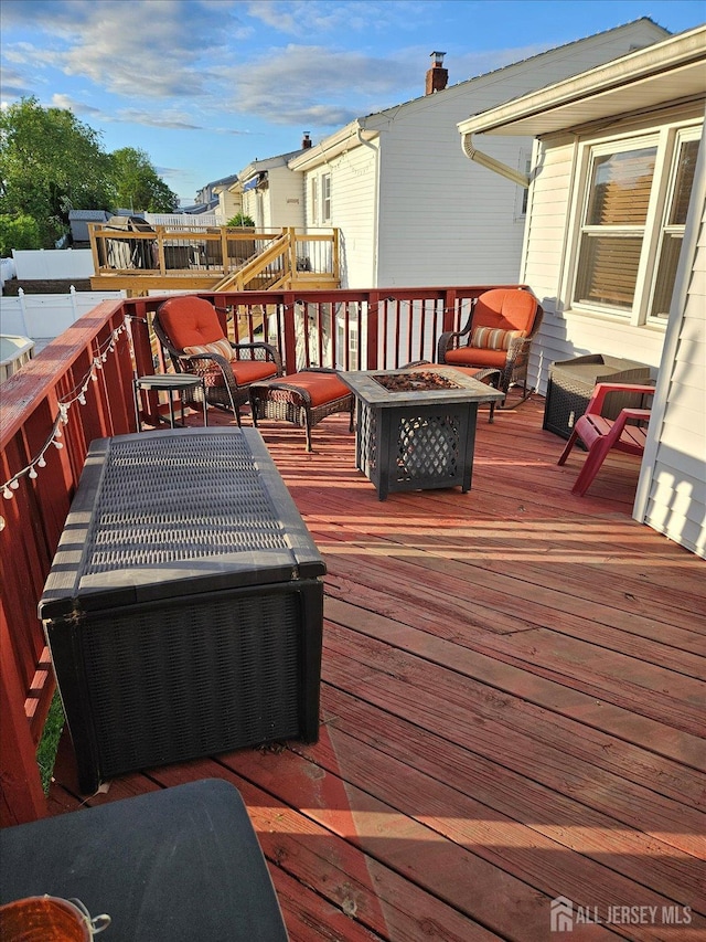 115 Broadway Ave, Colonia, NJ 07067 - deck with a fire pit