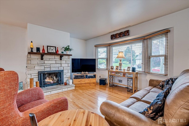115 Broadway Ave, Colonia, NJ 07067 - living room featuring wood finished floors and a fireplace