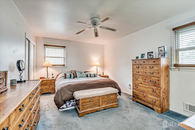 115 Broadway Ave, Colonia, NJ 07067 - carpeted bedroom featuring multiple windows, a closet, ceiling fan, and baseboards