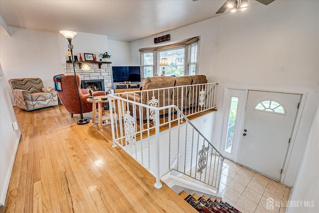 115 Broadway Ave, Colonia, NJ 07067 - entrance foyer featuring a ceiling fan, a stone fireplace, and hardwood / wood-style flooring