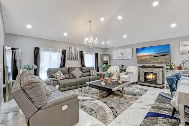 living room featuring marble finish floor, recessed lighting, vaulted ceiling, and a stone fireplace