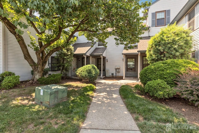 304 Woodbridge Commons Way, Iselin, NJ 08830 - view of front facade featuring roof with shingles