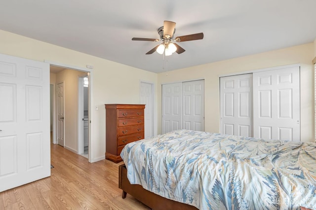 304 Woodbridge Commons Way, Iselin, NJ 08830 - bedroom with multiple closets, light wood finished floors, and ceiling fan