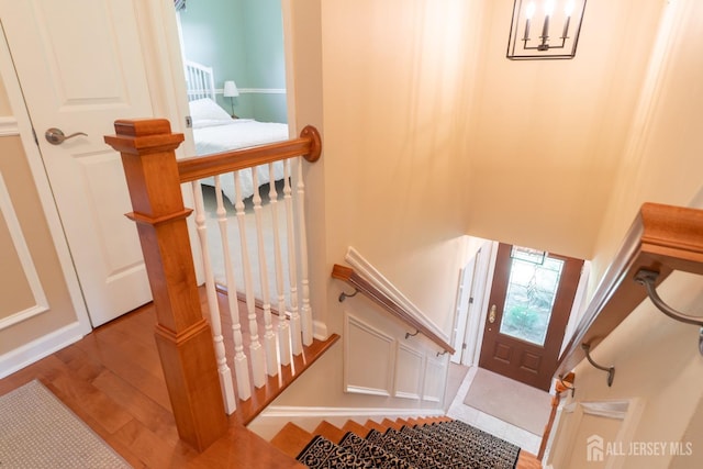 stairway with wood finished floors