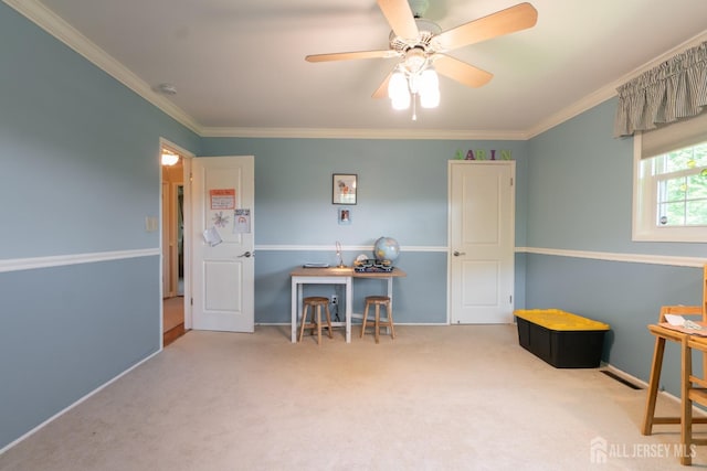 playroom featuring carpet flooring, ceiling fan, and ornamental molding
