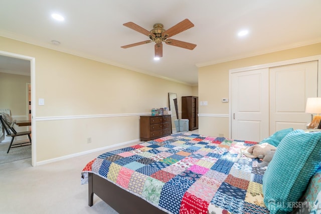 carpeted bedroom with crown molding, a closet, recessed lighting, ceiling fan, and baseboards