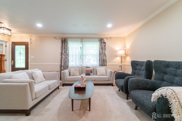 living area with crown molding and recessed lighting