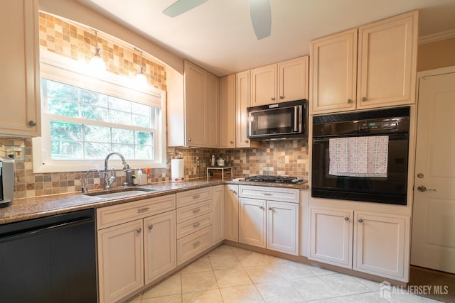 kitchen featuring black appliances, backsplash, a sink, and light tile patterned flooring
