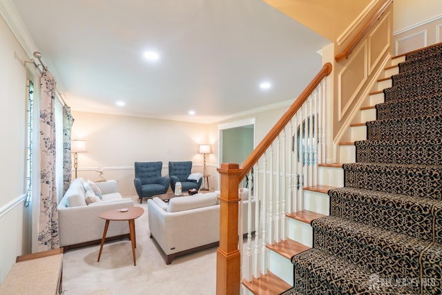 stairs with crown molding and recessed lighting
