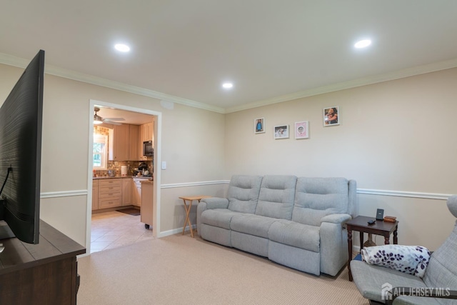 living room featuring recessed lighting, crown molding, baseboards, light tile patterned flooring, and ceiling fan