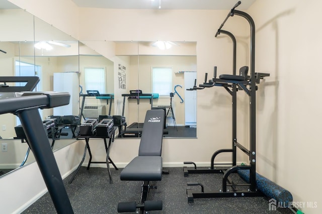 exercise area featuring baseboards and healthy amount of natural light
