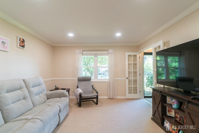 living room featuring crown molding, baseboards, light colored carpet, and recessed lighting
